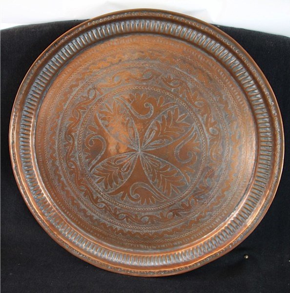 PAIR OF NEPALESE HAND TOOLED COPPER TRAYS: 23" AND 24" RESPECTIVELY