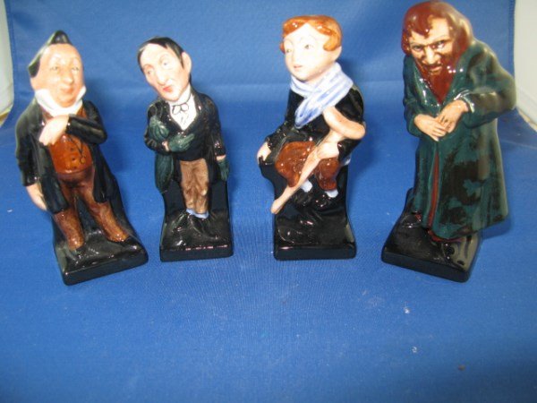 FOUR ROYAL DOULTON FIGURINES - CHARLES DICKENS: "TINY TIM", 'STIGGINS", "PECKSNIFF", "FAGIN" NO HN NUMBERS