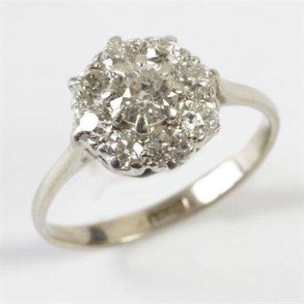 ANTIQUE 18K WHITE GOLD DIAMOND FLORAL CLUSTER RING: NINE OLD CUT STONES, MILLI GRAIN AND CLAW SETTINGS TOTAL WEIGHT APPROX. 1.00 CARAT SIZE 6.5 US