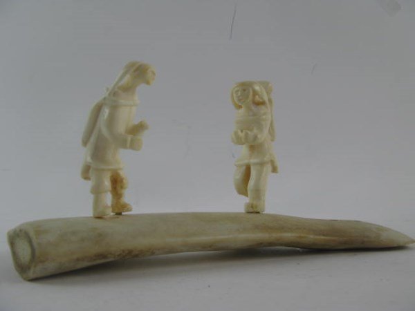 INUIT CARVED ANTLER AND IVORY SCENE: UNIDENTIFIED ARTIST, SIGNED IN SYLLABICS, CIRCA 1970'S 4.5" X 9.75' X 4"
