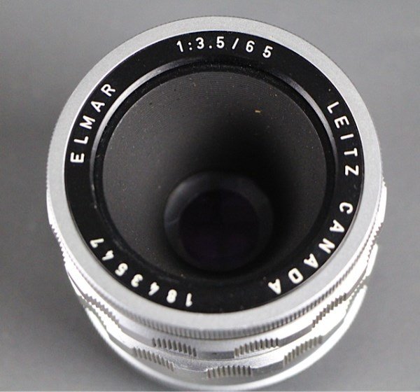 LEICA LEITZ CANADA , ELMAR f3.5/65 MM LENS: LEITZ CANADA 1843547, ELMAR, f3.5/65 COMPLETE WITH LENS COVERS