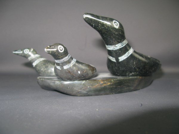 INUIT ESKIMO CARVING- PAULOOSIE PAULOOSIE: INUIT (1915-1979) OF INUKJUAK FAMILY OF LOONS CIRCA 1950'S SIGNED EN VERSO IN ENGLISH, SYLLABICS AND NUMBERED 9" X 4" X 3"