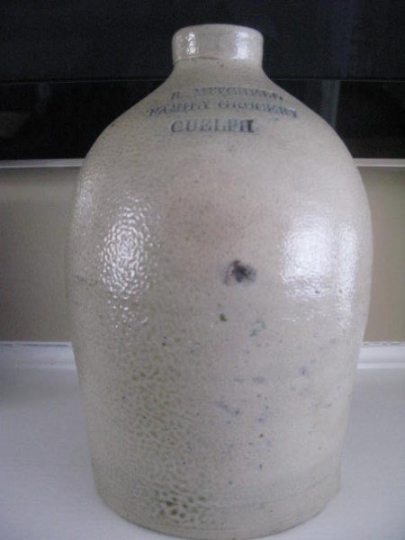 SIGNED ONE GALLON ANTIQUE JUG: R. MITCHELL FAMILY GROCERS GUELPH 9" H