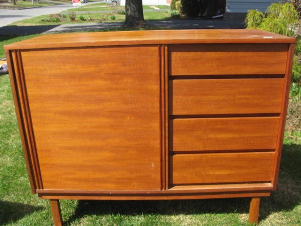 TEAK SERVER: FRONT SLIDING DOOR FLANKED BY FOUR DRAWERS 39" H X 48" X 19"