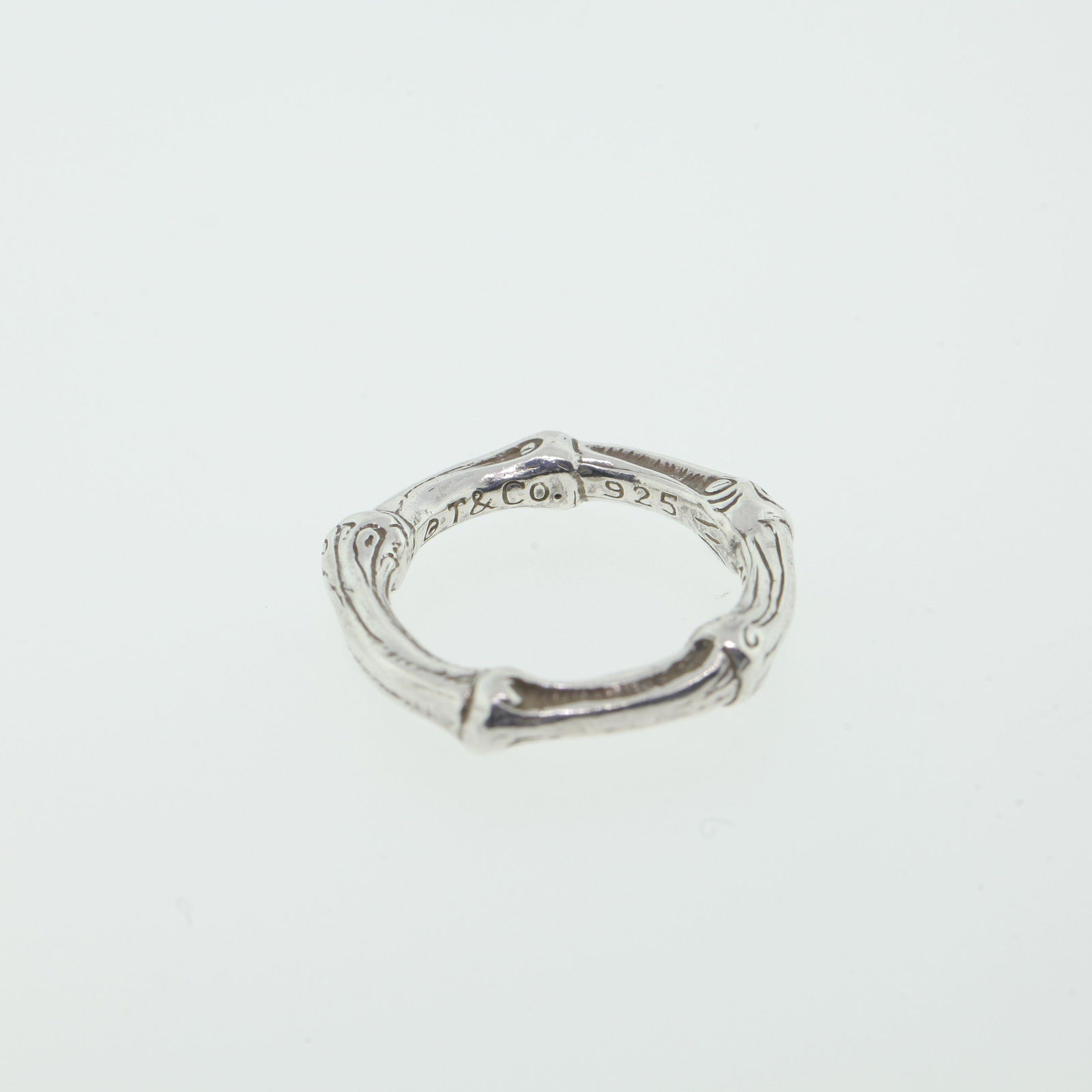 TIFFANY & CO BAMBOO STERLING SILVER RING: 1996 COPYRIGHT TIFFANY & CO. BAMBOO STYLE STERLING SILVER RING - Examine all photos closely. Contact Lionheart Auction Group for more detailed information if needed. Lionheart Auction Group is not res