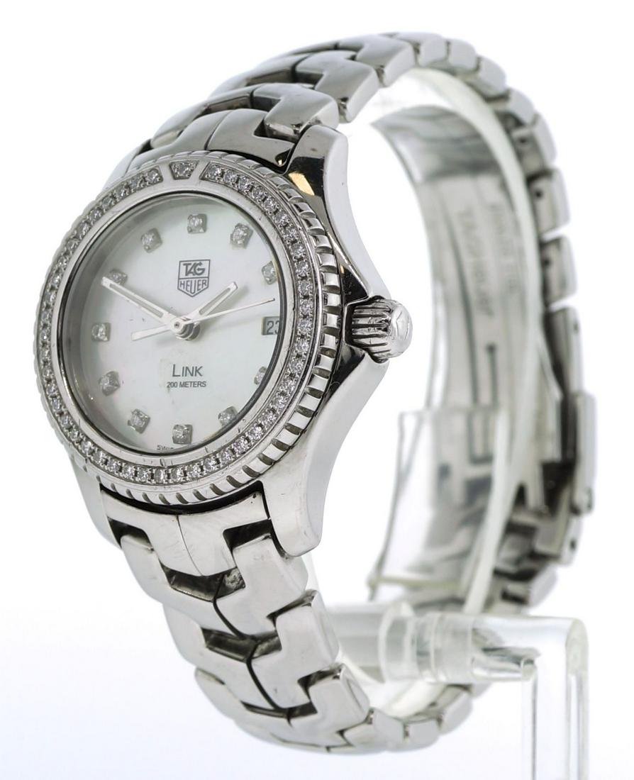 Ladies Tag Heuer Link Wristwatch with MOP & Diamond: Ladies Tag Heuer LINK Ref. WJ131A Quartz Wristwatch has Mother-Of-Pearl Dial with Diamond Markers. The stainless steel watch and original bracelet weigh 65.8 grams - Examine all photos closely. Contac