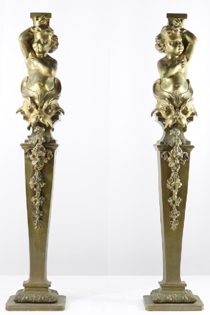 Pair of Bronze Cherub Andirons: Pair of bronze cherub andirons. 29 3/4" H x 6" L x 3 3/4" W