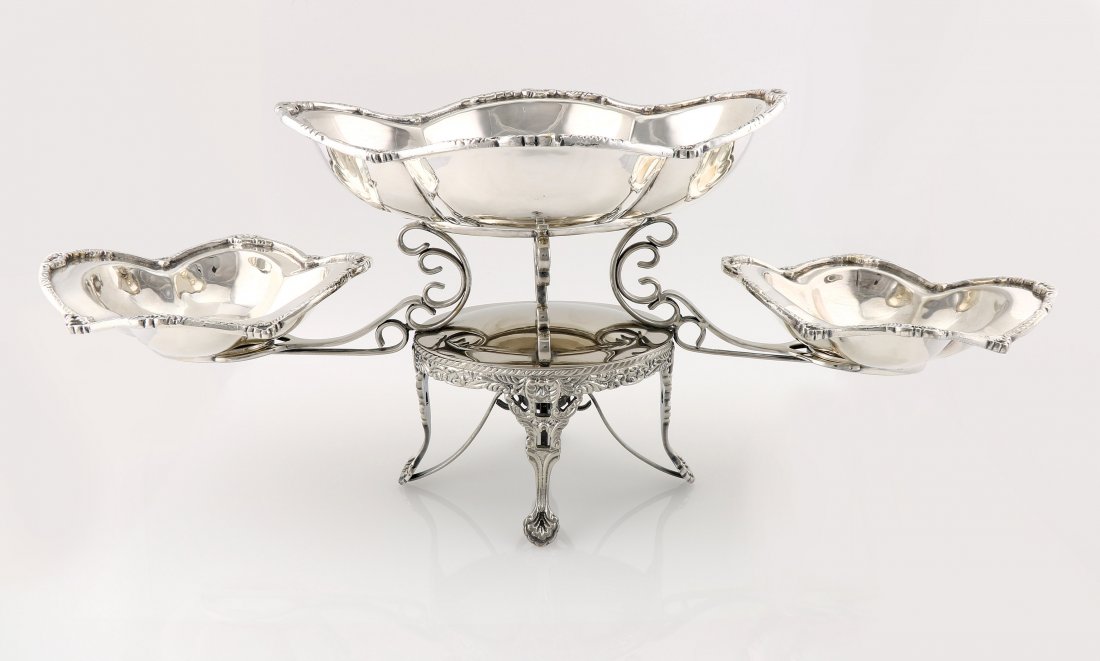 Silverplate Mottahedeh Epergne: Silver plate epergne by Mottahedeh featuring a unique ornate design along with 3 removable dishes. It measures 9" tall x 23.5" wide. In great shape just showing light scratching consistent with a