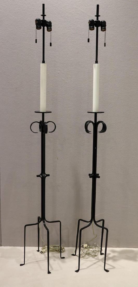 Pair of Decorative Floor Lamps Attributed to Parzinger: Pair of decorative floor lamps attributed to Tommi Parzinger. They are in great condition. Measures 67" tall. In overall great condition just showing a little bit of discoloration on the white pi