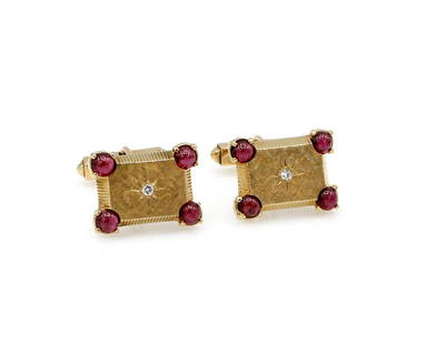 Lucien Picard 14K Yellow Gold Ruby & Diamond Cufflinks: Lucien Picard cufflinks in 14k yellow gold featuring approx 2.80ctw of ruby cabochons along with approx 0.10ctw of diamonds. They are 21mm x 16mm and weigh 15.2 grams. Signed on the bar with the gold