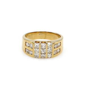 18K Yellow Gold Invisible Set Diamond Band: Band in 18k yellow gold featuring 9 princess cut invisible set diamonds along with 8 round accent diamonds weighing approx 1.40ctw. It is 8mm wide at the top, a size 6.5, and it weighs 6.2 grams.