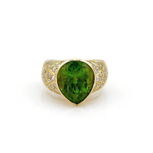 18K Yellow Gold 8.36ct Peridot & Diamond Ring: Ring in 18k yellow gold featuring a 8.36ct pear shape peridot along with approx 0.50ctw of diamonds with H-I color and VS clarity. It is 15mm wide at the front, a size 5.75, and weighs 11.1 grams. 