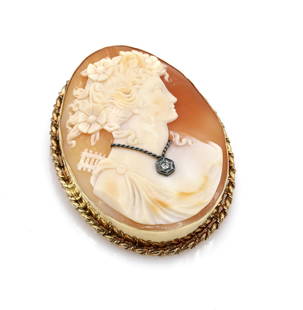 14K Yellow Gold Diamond Shell Cameo Brooch Pendant: Very well done cameo in 14k yellow gold depicting a woman wearing a necklace set with a diamond weighing approx 0.02ct. It is 54mm x 42mm and weighs 22.6 grams. Also has a bail so it can be worn as a