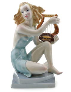 Giovanni Ronzan Hand Painted Porcelain Harpist Figurine: Hand painted Italian porcelain figurine depicting a woman playing a harpsichord by Giovanni Ronzan. It is in great condition just showing a small chip on the base. Fully signed on the bottom. Please s