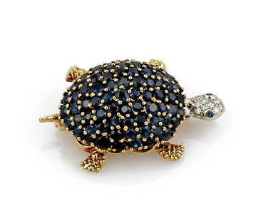 Sapphire and Diamond Turtle Brooch in 18K Yellow Gold: 18k yellow gold turtle brooch set with blue sapphire and diamonds. It is 43mm x 26mm and weighs 16 grams. Stamped with gold content and a Paris designer's hallmark. ***FREE JEWELRY SHIPPING FOR