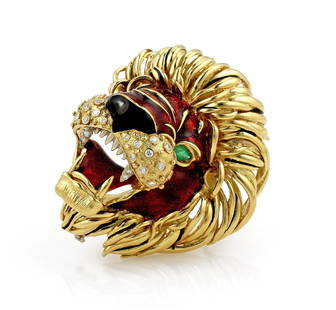 Frascarolo Diamond and Enamel Lions Head Brooch: Diamond and enamel lions head brooch by Frascarolo in 18k yellow gold. Features a red and black enamel, diamonds, and 1 emerald. Small chip to black enamel on nose. It is 62mm x 65mm and weighs 98