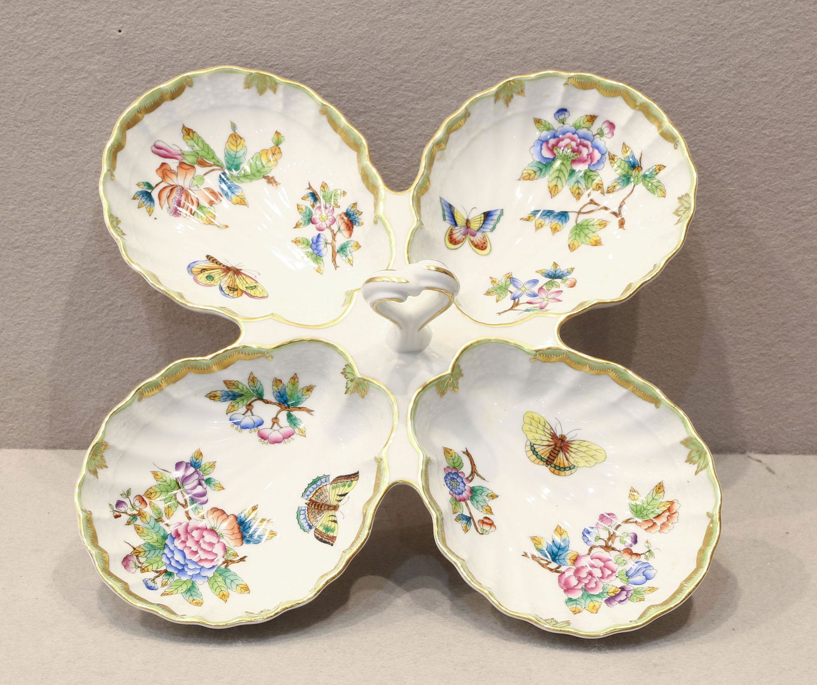 Herend Queen Victoria Relish Dish: Herend Queen Victoria relish dish in great condition. Hand painted with butterflies and flowers. Measures 11" x 11". Please review all photos closely. The nonappearance of a condition report d