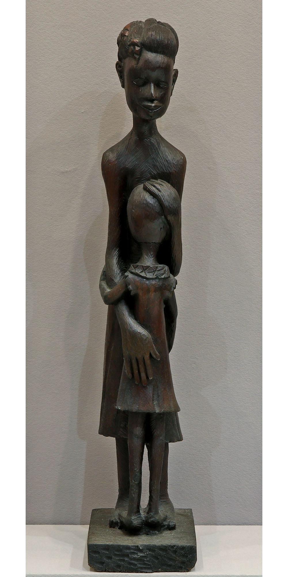 Roger Francois (Haiti, 1928-2013) Wooden Sculpture: Wood sculpture of a mother and child by Roger Francois. Measures approx 39.5" T x 8"W x 9.5"D. Please review all photos closely. The nonappearance of a condition report does not mean that 