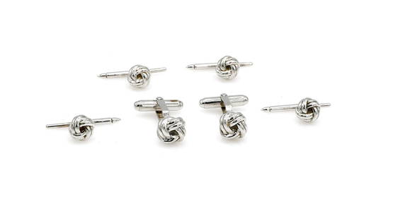 Sterling Silver Cufflink & Stud Set: Cufflink and stud set in sterling silver featuring a unique knot design. The cufflinks measure approx 25mm x 10mm and the studs measure approx 13mm x 9mm. Set weighs 24.7 grams. wpm950502 