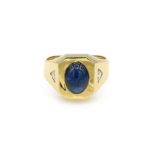 18K Yellow Gold Sapphire Cabochon & Diamond Ring: Unique ring in 18k yellow gold featuring an approx 6.00ct blue sapphire cabochon along with 0.45ctw of diamonds. It is 15mm wide, a size 9.25, and weighs 10.9 grams. Lightly worn. wsalr027  Shipping f