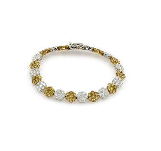 18K 2 Tone Gold 9.75ct Diamond Flower Link Bracelet: Elegant bracelet in 18k white and yellow gold featuring approx 9.75ctw of white and irradiated diamonds. It is 6.25" long, 7mm wide, and weighs 14.3 grams. wpm876105 Shipping for jewelry