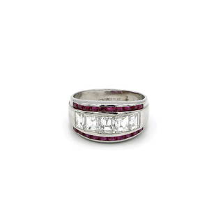 Retro Platinum Diamond and Ruby Band: Beautiful Retro band featuring 5 emerald cut diamonds weighing approx 1.75ctw. Top and bottom of the band is accented with channel set ruby gemstones. Ring is 10mm wide at the top, size 6.5, and