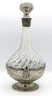 Tiffany & Co Sterling Silver Overlay Decanter: Sterling silver overlay decanted signed Tiffany & Co. In overall good condition. Does show some chipping on the glass lip under the silver sleeve as well as a fleabite here or there on the