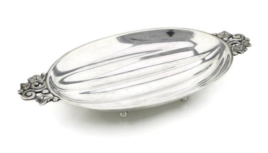 Tiffany & Co Makers Sterling Silver Tray: Sterling silver tray by Tiffany & Co Makers featuring a ribbed design along with 2 handles with a floral motif. Stamped and hallmarked on the reverse. Measures approx 10" x 5.25" and