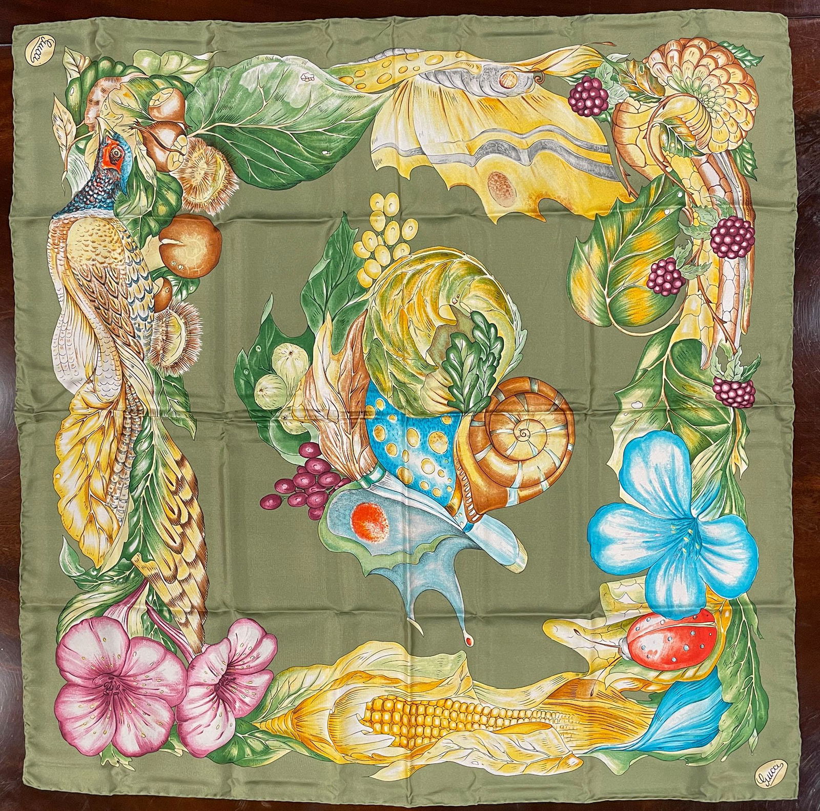Gucci Silk Scarf: Gucci silk scarf in excellent condition. Includes original box. Measures 33.5" x 33.5". Please review all photos closely. The nonappearance of a condition report does not mean that the lot is