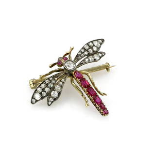 14K 2 Tone Diamond & Ruby Dragonfly Brooch: Elegant dragonfly brooch in 14k yellow and white gold featuring diamonds and rubies. Circa 1890's. Measures approx 34" x 40" and weighs 6 grams. wpm962047 Have a similar item to sell?