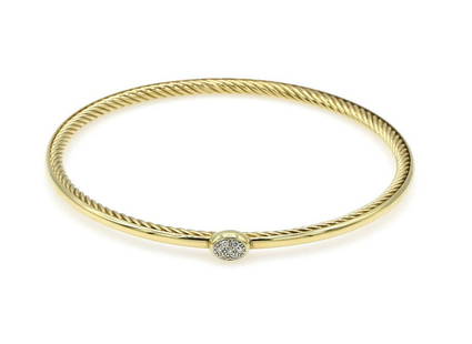 David Yurman 18K YG Pave Diamond Cable Bangle: Cable bangle in 18k yellow gold by David Yurman featuring a single pave diamond station on the front and Yurman's signature cable design on the inside. The bangle is 3mm wide, has an inner