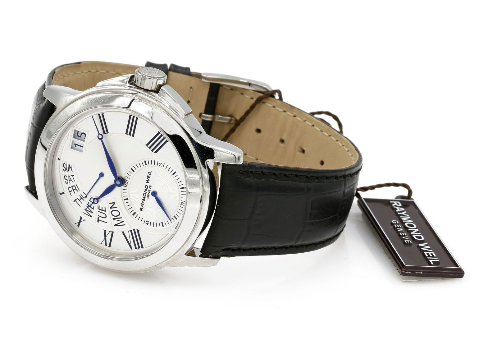 Raymond Weil Stainless Tradition Quartz Watch 9579: Raymond Weil Tradition in stainless steel on leather strap. Features a quartz movement, day/date display, and a seconds subdial at the 6 o'clock position. It has a 42mm case. New Old Stock. List $