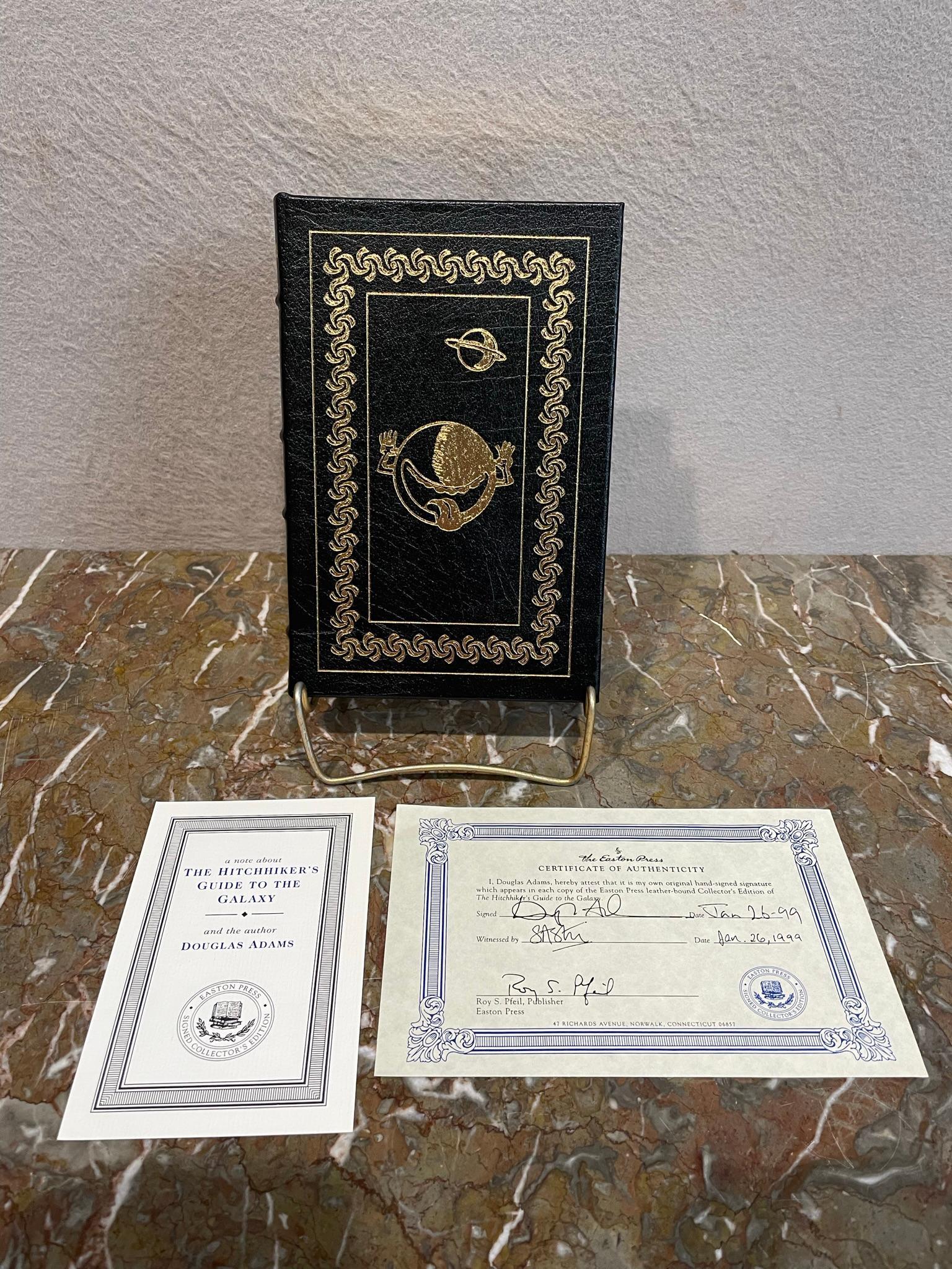 The Hitchhiker's Guide to the Galaxy by Douglas Adams: This is a signed edition of "The Hitchhiker's Guide to the Galaxy" by Douglas Adams. It was printed in 1998 by The Easton Press and is in excellent condition. It measures 8.5" tall Bo