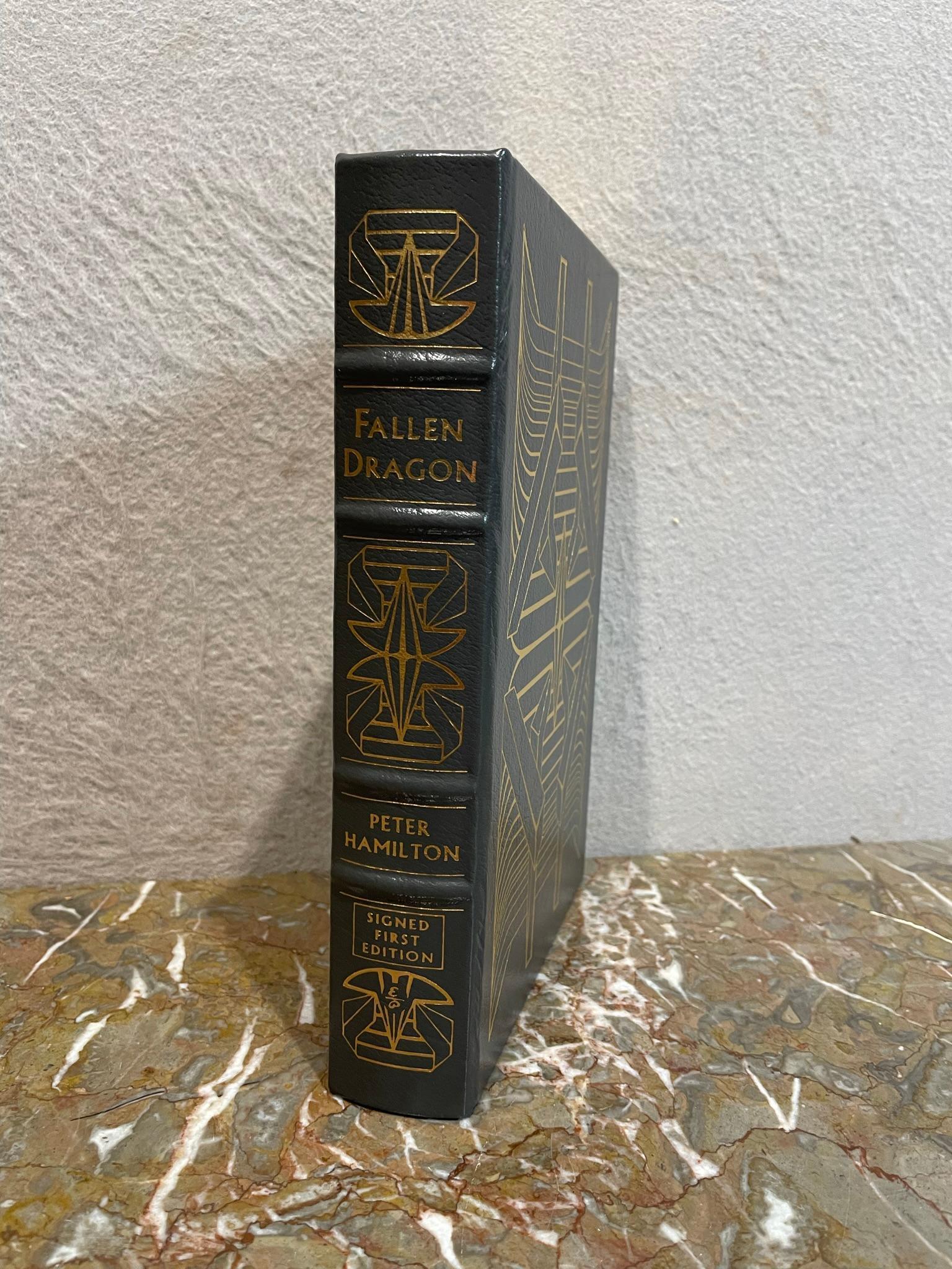 Fallen Dragon by Peter Hamilton-signed 1st edition: This is a signed first edition of "Fallen Dragon" by Peter Hamilton. It is numbered 850 of 1,075. It was printed in 2002 by The Easton Press and is in excellent condition. It measures 9.5"