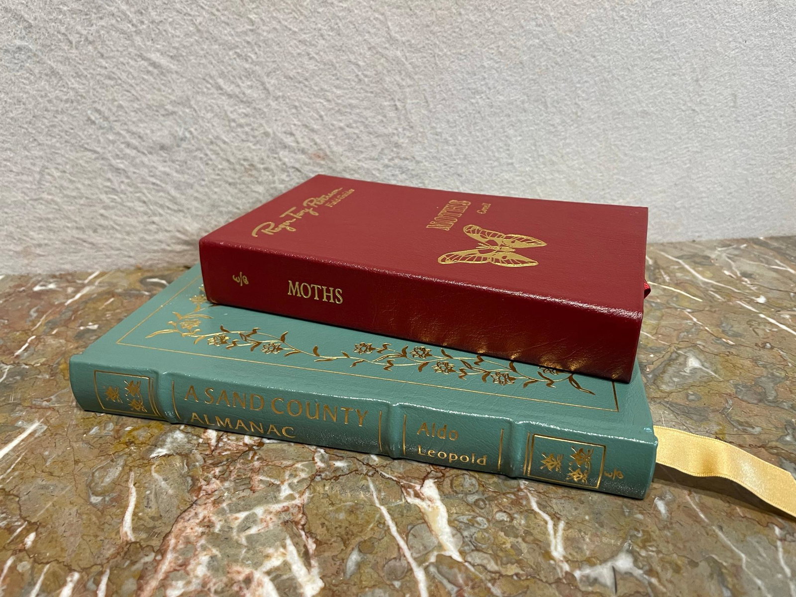 Set of 2 Nature Books by The Easton Press: This set of two nature books were printed by The Easton Press and are in excellent condition. The set includes 1. A Sand County Almanac by Aldo Leopold was printed in 1995 and measures 9" tall 2.