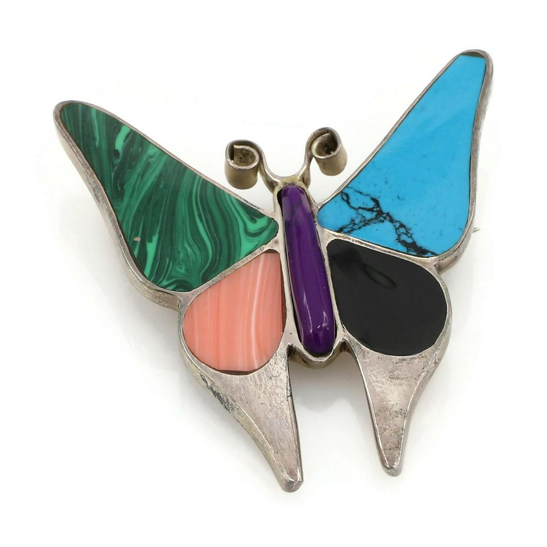 Mexican Sterling Silver Semi Precious Butterfly Brooch: Sterling silver butterfly brooch featuring various multi colored semi precious inlays. Signed on the reverse "Dare to be Free & Fly" HB. It is 56mm x 51mm and weighs 23 grams. Have a simil