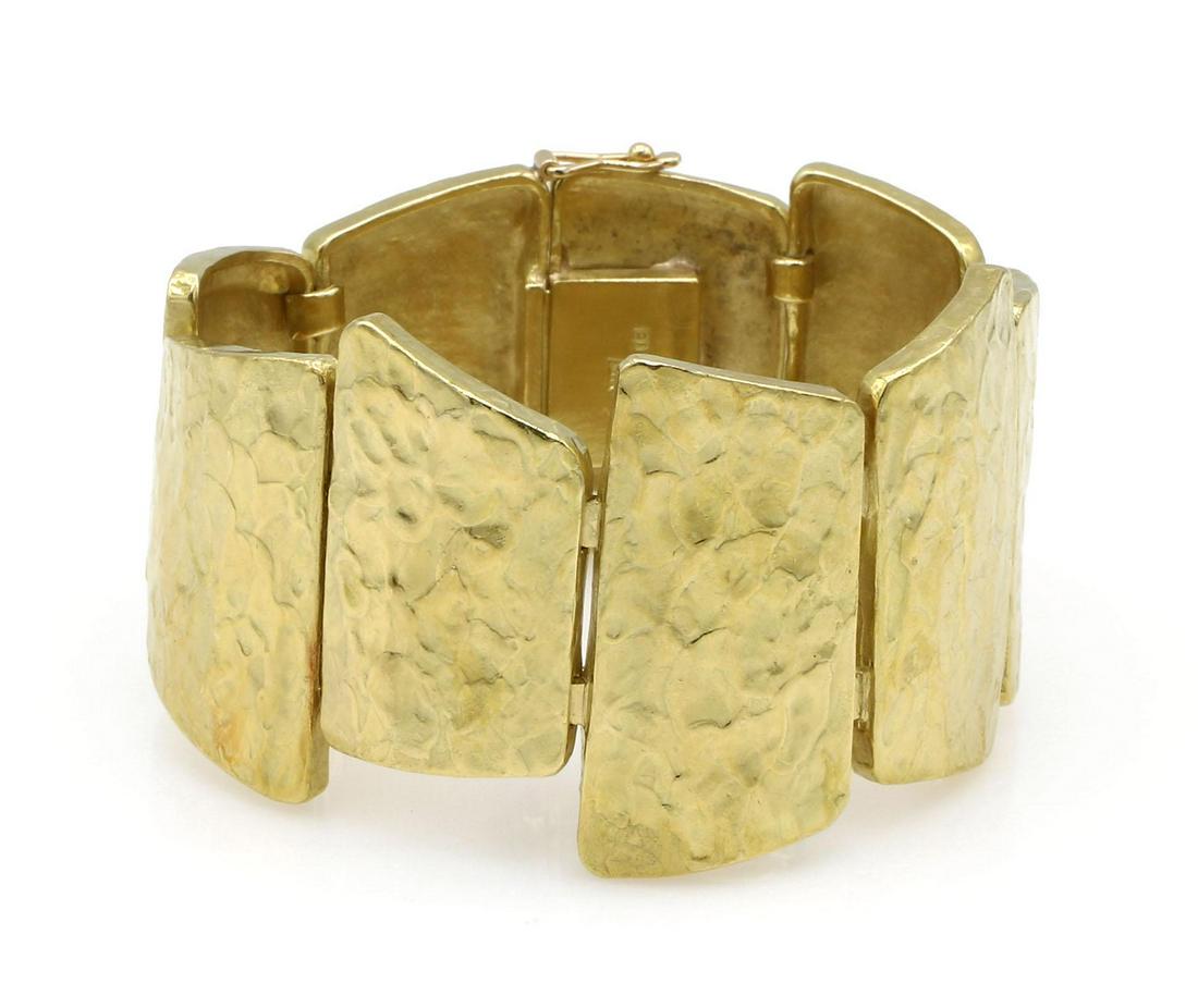 Ed Wiener 18K Yellow Gold Hammered Link Bracelet: Fabulous hammered link bracelet in 18k yellow gold by Ed Wiener. It is approx 6.75" long, 37mm wide and weighs 74 grams. Circa 1970. wpm999201 Have a similar item to sell? Contact us at info@