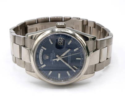 Rolex 18Kt Day-Date 36MM Watch: Rolex 18Kt White Gold Day-Date 36MM Men's Watch. Style #118109. Dial is Blue Waves, Arabic. With original box and papers. Weight of watch is approx. - 111.4 dwt. Have a similar item to sell? 