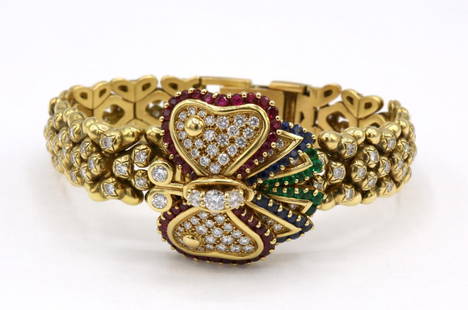 Rare Audemars Piguet 18Kt Diamond Ladies Watch: Rare Audemars Piguet 18Kt Yellow Gold Emerald, Ruby, Sapphire & Diamond Ladies Butterfly Watch. Measures approx. - 6 3/4" long. Weight approx. - 48.2 dwt. "No. 1" on back. Quartz