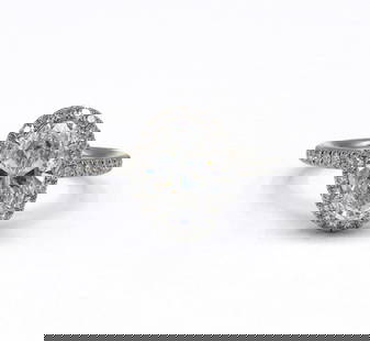 Rare Harry Winston "The One" Diamond Engagement Ring: Rare Harry Winston "The One" 2.61 CTW. Diamond Engagement Ring. Set with an oval brilliant cut diamond weighing 2.01ct. And measuring 10.11 x 6.91 x 4.50mm. Within a frame of pave set round br