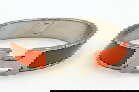Hermes Orange Clic H Enamel Bracelet: Hermes Orange Clic H Enamel Bracelet. Measures approx. - 3/8" thick. Measures approx. - 2" inside across. Have a similar item to sell? Contact us at info@marketauctionsinc.com **If you do