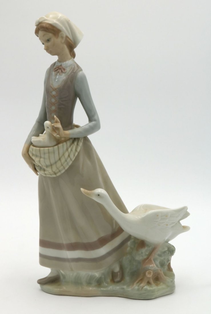 Lladro "Girl with Goose" #4815 Porcelain Sculpture: Lladro "Girl with Goose" #4815 Porcelain Sculpture. Measures approx. - 12 1/2" high x 8 1/4" wide. Have a similar item to sell? Contact us at info@marketauctionsinc.com Please review all photos closel
