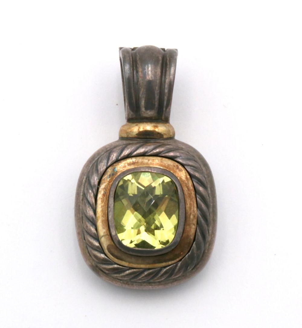 David Yurman 14Kt & Sterling Silver Pendant: David Yurman 14Kt Yellow Gold & Sterling Silver Pendant. With faceted lemon citrine. Measures approx. - 1 1/2" long. Weight approx. - 17.6 grams. Have a similar item to sell? Contact us at inf