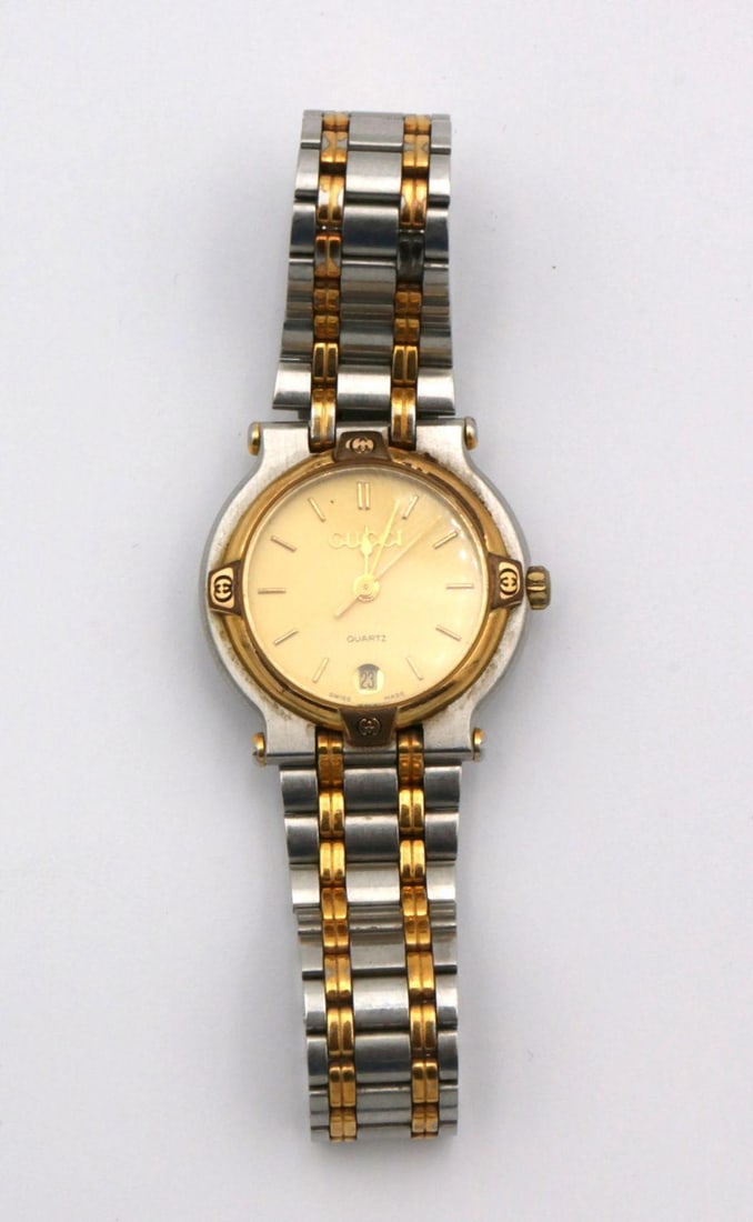 Vintage Gucci Two-Tone Ladies Wristwatch: Vintage Gucci Two-Tone Ladies Wristwatch. 18Kt gold plated and stainless steel watch. Measures approx. - 7" wrist. Have a similar item to sell? Contact us at info@marketauctionsinc.com Please