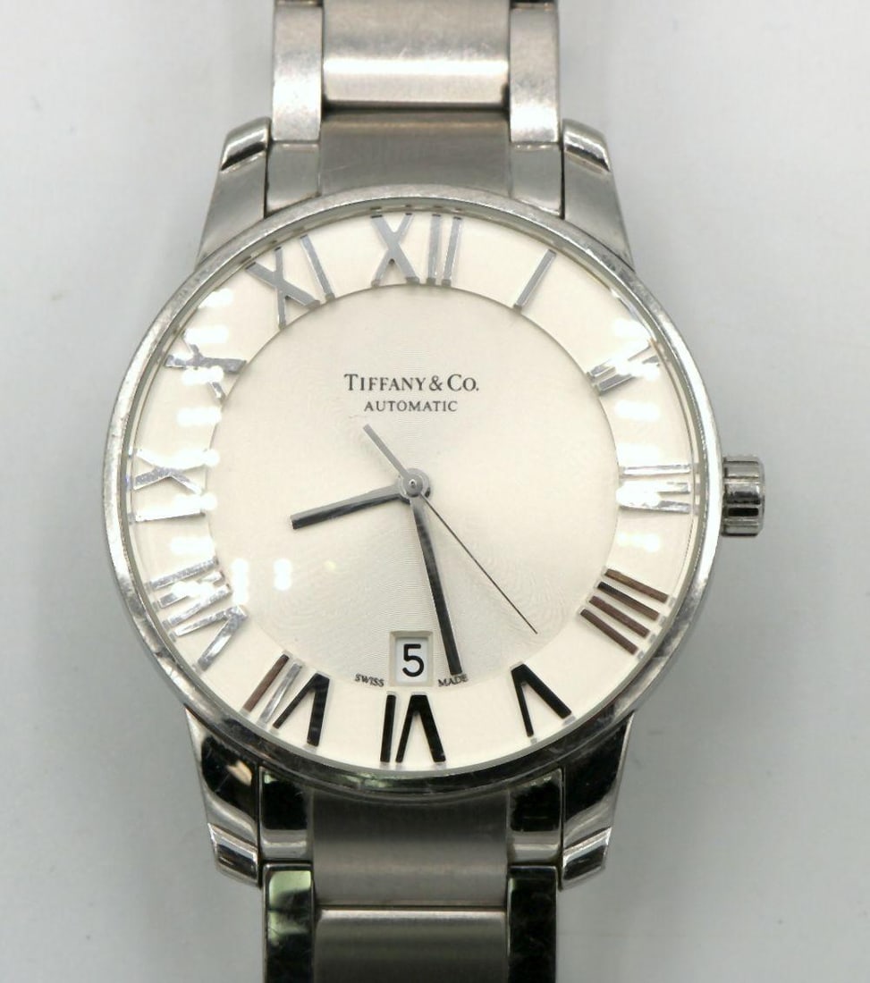 Tiffany & Co. "Atlas" 38MM Stainless Steel Watch: Tiffany & Co. "Atlas" 38MM Stainless Steel Men's Watch. WPM1031205 Have a similar item to sell? Contact us at info@marketauctionsinc.com **If you do not want us to ship for you, p