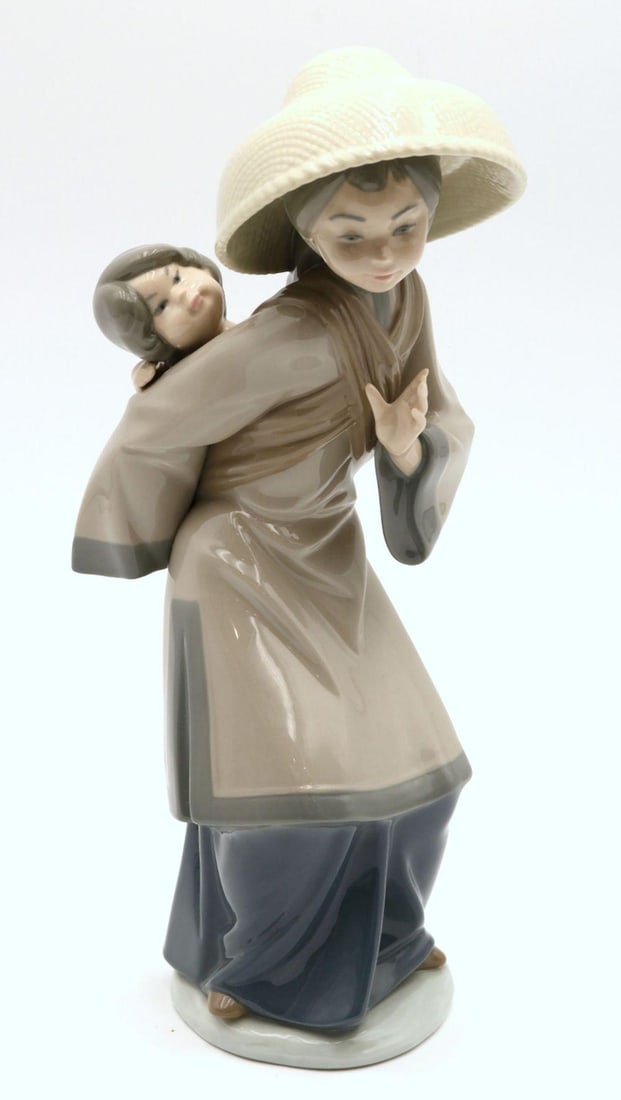 Lladro "My Precious Bundle" #5123 Porcelain Sculpture: Lladro "My Precious Bundle" #5123 Porcelain Sculpture. Measures approx. - 10 3/4" high x 4 3/4" wide. Have a similar item to sell? Contact us at info@marketauctionsinc.com Please r