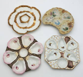 Lot of Four Porcelain Oyster Plates: Lot of Four Porcelain Oyster Plates. Light pink and brown colored 6 well plate - 9 1/2&#34; diameter, 5 well brown and gilt colored plate - 8 1/4&#34; square, oriental style 5 well plate - 8 3/8&#34;