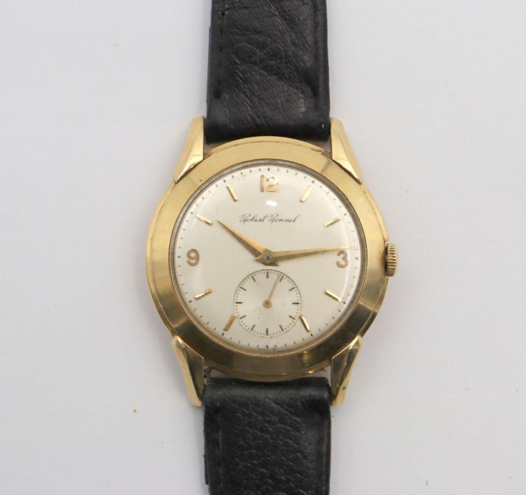 Robert Ronnel 14Kt Men's Wristwatch: Robert Ronnel 14Kt Men's Wristwatch. Swiss movement, 17 jewels, large size, fancy lugs, wide bezel, 1950's, subsidiary second hand. Have a similar item to sell? Contact us at info@marketau
