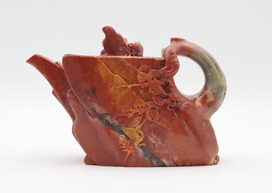 Chinese Hand Carved Jadeite Tea Pot: Chinese Hand Carved Jadeite Tea Pot. Depicting tree branch on sides. Measures approx. 4" high x 6" wide. Have a similar item to sell? Contact us at info@marketauctionsinc.com Please review