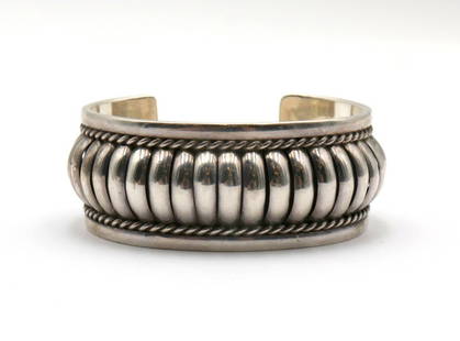 James Martin Navajo Sterling Silver Bracelet: James Martin Navajo Sterling Silver Bracelet. Marked &#34;Sterling&#34; and &#34;JM&#34;. Measures approx. - 2 1/2&#34; inside across. Weight approx. - 54.6 grams. FM32265 #2  Have a similar item to s